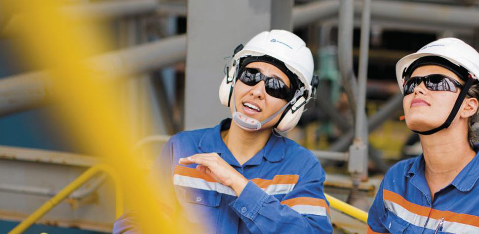 Image of two women working in plant