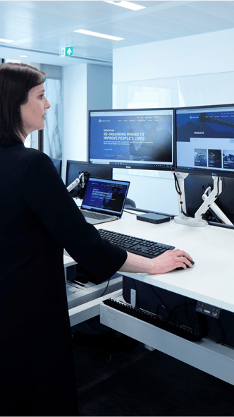 Woman works at a computer desk