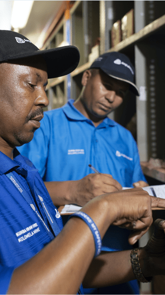 Two men check inventory